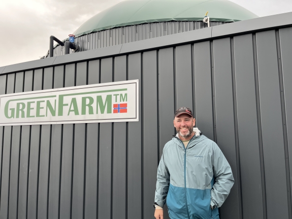 GreenFarmer Christian Hansen standing in front of his GreenFarm plant